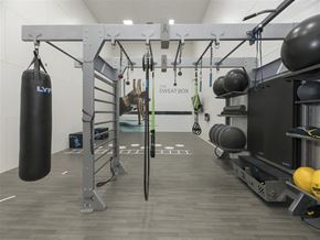 Vacaville apartment for rent - A gym with a punching bag, weights, and exercise equipment.