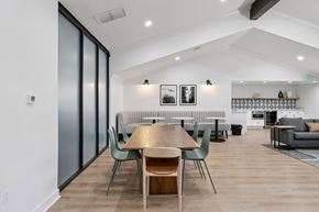 Cupertino apartment for rent - A modern dining room with a wooden table and chairs.