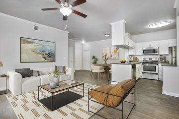 Aliso Viejo apartment for rent - A modern living room with a white couch and a coffee table.