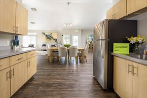 Pittsburg apartment for rent - A kitchen with a dining table and chairs in the middle of the room.