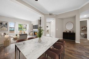 Laguna Niguel apartment for rent - A dining room with a marble table and chairs.