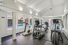 Vancouver apartment for rent - A gym with a row of treadmilers and elliptical machines.