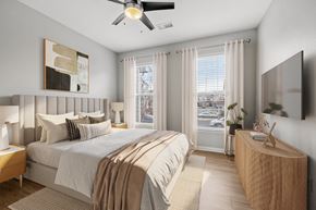 Parker apartment for rent - A bedroom with a large bed and a ceiling fan.