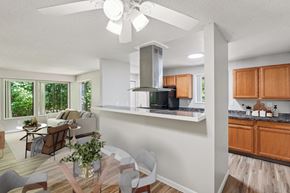 Vancouver apartment for rent - A modern kitchen with a stainless steel range hood and wooden cabinets.