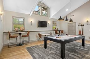 Lakewood apartment for rent - A room with a pool table and a tv.