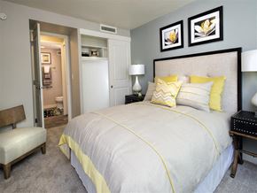 Portland apartment for rent - A bedroom with a large bed and a chair.