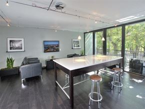 Portland apartment for rent - A modern dining room with a long table and chairs.