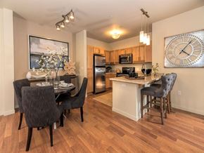 Tigard apartment for rent - A kitchen with a dining table and chairs.