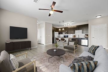 Greenwood Village apartment for rent - A living room with a grey couch and a brown coffee table.