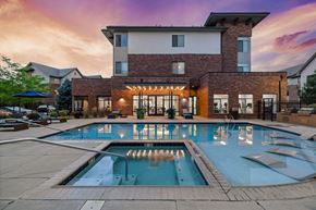 Greenwood Village apartment for rent - a large swimming pool in front of a building