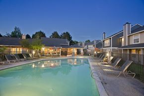 Vancouver apartment for rent - A swimming pool surrounded by lounge chairs at a resort.