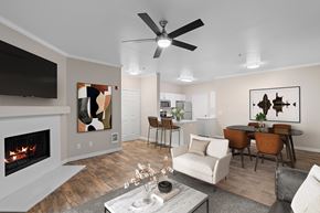 Hillsboro apartment for rent - A living room with a fireplace and a television.