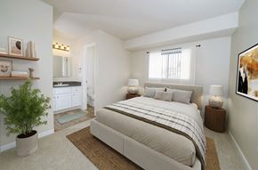 Martinez apartment for rent - A bedroom with a large bed and a potted plant.