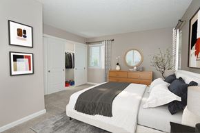 Martinez apartment for rent - A bedroom with a large bed and a mirror on the wall.