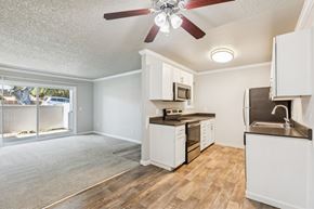 Martinez apartment for rent - A kitchen with white cabinets and a brown countertop.