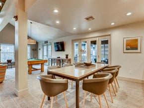 Renton apartment for rent - A dining room with a long table and chairs.