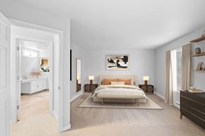 Beaverton apartment for rent - A bedroom with a large bed and a painting on the wall.