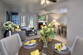Vancouver apartment for rent - A dining room with a table set for two and a ceiling fan.