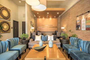 Monrovia apartment for rent - A living room with a blue couch and a wooden coffee table.