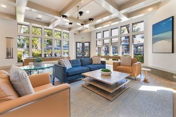 Aliso Viejo apartment for rent - A living room with a blue couch and a brown armchair.