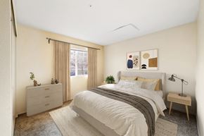 Pittsburg apartment for rent - A bedroom with a bed, nightstand, and lamp.