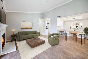 Livermore apartment for rent - A living room with a fireplace and a painting on the wall.
