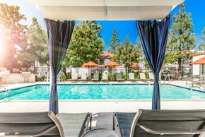 Alta Loma apartment for rent - A pool area with sun loungers and a canopy.