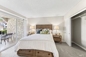 Laguna Niguel apartment for rent - a bedroom with a bed and a sliding glass door to a patio