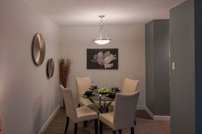 Winnipeg apartment for rent - A dining room with a table set for two.