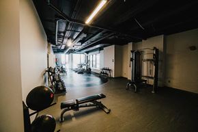 Winnipeg apartment for rent - a gym with weights and other equipment in a building