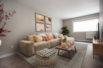 Winnipeg apartment for rent - a living room with a couch and a coffee table