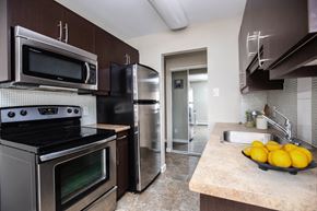 Winnipeg apartment for rent - a kitchen with stainless steel appliances and a sink