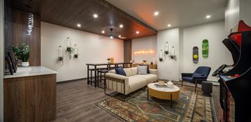 Calgary apartment for rent - A living room with a white couch and a coffee table.