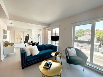 Winnipeg apartment for rent - A living room with a blue couch and a gold coffee table.