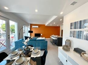 Winnipeg apartment for rent - A modern dining room with a table set for a meal.