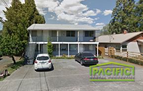 Ashland apartment for rent - a house with a parking lot and cars in front of it