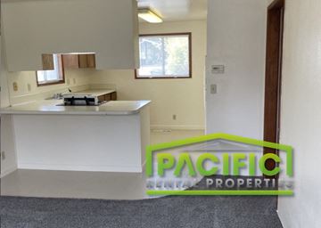 Ashland apartment for rent - a description of a kitchen in a house with a green logo