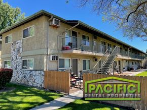 Medford apartment for rent - a building with a pacific rental properties sign in front of it