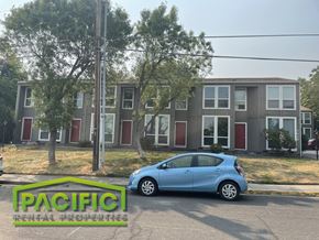Ashland apartment for rent - a blue car parked in front of an apartment building
