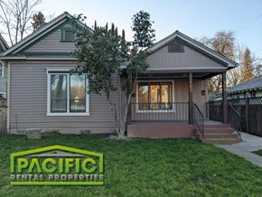 Medford apartment for rent - a remodeled house with a front yard and grass