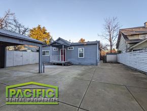 Medford apartment for rent - a small blue house with a driveway in front of it