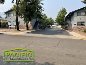 Ashland apartment for rent - an empty street in a neighborhood with houses and trees