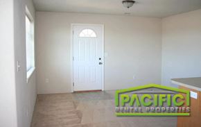 Medford apartment for rent - an empty living room with a white door