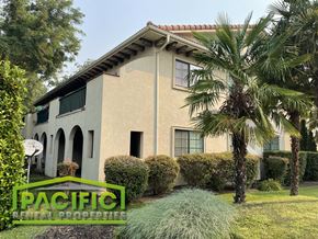 Medford apartment for rent - a house with palm trees in front of it