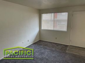 Ashland apartment for rent - an empty room with a window and a door