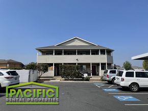 Central Point apartment for rent - a building with cars parked in a parking lot