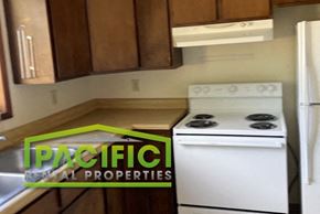 Ashland apartment for rent - a kitchen with a stove and a refrigerator in it