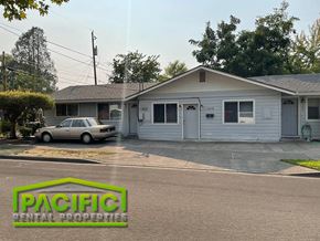 Medford apartment for rent - a white house with a car parked in front of it