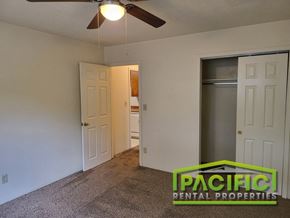 Medford apartment for rent - the preserve at ballantyne commons apartment living room with closet and ceiling fan