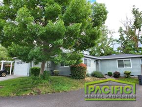 Medford apartment for rent - a blue house with a tree in the front